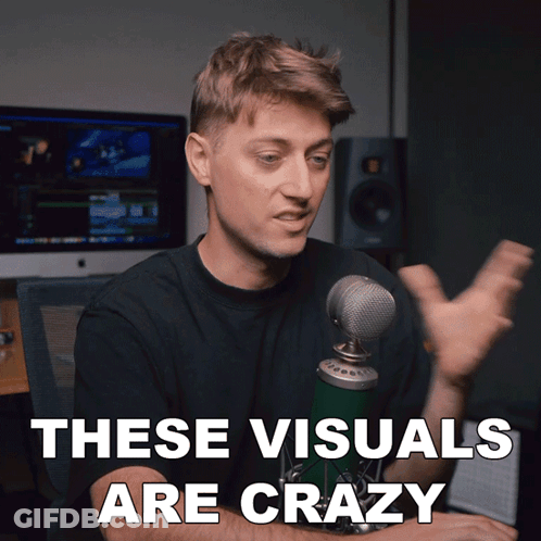 A Man In Front Of A Microphone With The Words These Visuals Are Crazy GIF