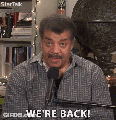 Man In Front Of Microphone Saying We Re Back GIF