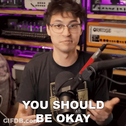 A Man In Front Of A Microphone With The Words You Should Be Okay Above Him GIF