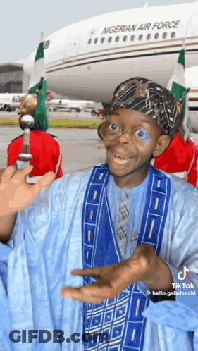 A Man In Front Of A Nigerian Air Force Plane GIF