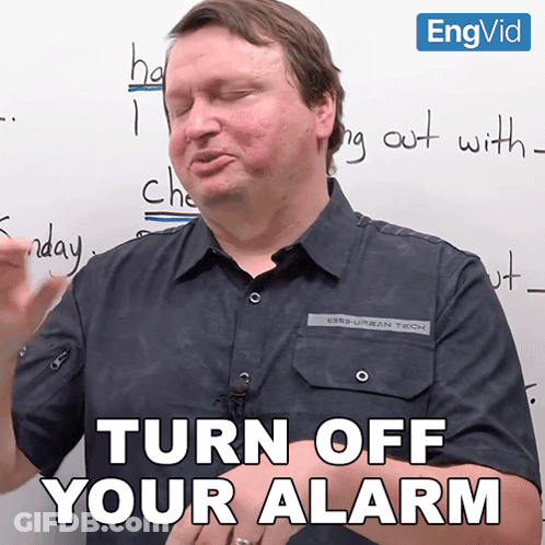 A Man In Front Of A Whiteboard Says Turn Off Your Alarm GIF