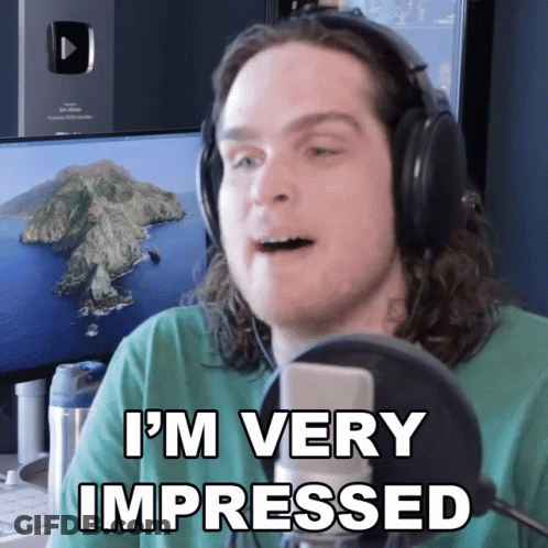 A Man In Headphones Says I 'M Very Impressed GIF