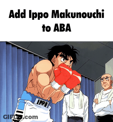 A Man In Ippo Boxing Gloves Stands In Front Of A Blue Curtain GIF