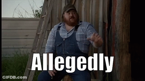 A Man In Overalls And A Plaid Shirt Is Sitting In Front Of A Wooden Fence With The Word Allegedly Written On It GIF