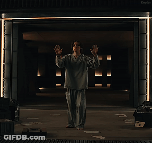 A Man In Pajamas Says I 'M I 'M Bob While Standing In A Dark Room GIF