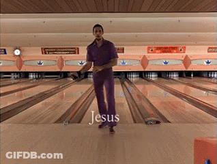 A Man In Purple Pants Is Standing On A Bowling Alley With The Word Jesus Written On The Floor GIF