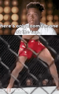 A Man In Red Shorts Is Standing In A Cage With The Words `` Here 'S Only Room For One At The Top '' . GIF