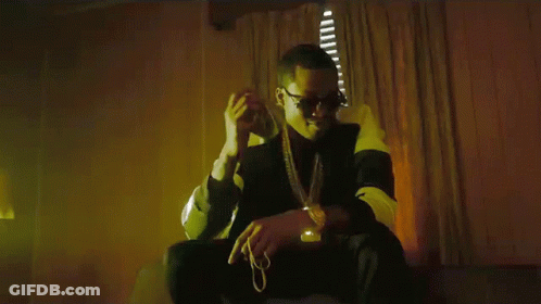 A Man In Sunglasses Is Holding A Bunch Of Money In His Hand GIF