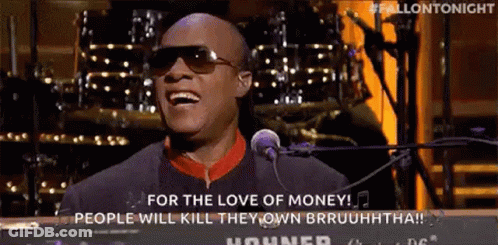 A Man In Sunglasses Is Singing Into A Microphone While Playing A Keyboard . GIF