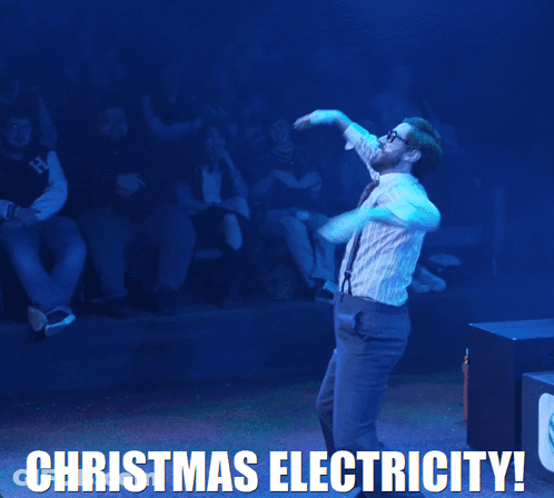 A Man In Suspenders Is Dancing With The Words Christmas Electricity Behind Him GIF