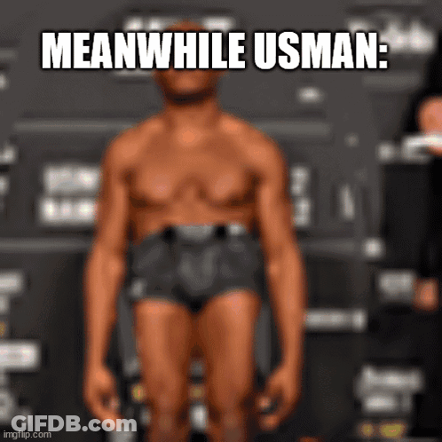A Man In Underwear Is Standing In Front Of A Sign That Says Meanwhile Usman . GIF