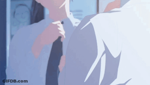 A Man Is Adjusting His Tie In Front Of A Mirror While Another Man Looks On . GIF
