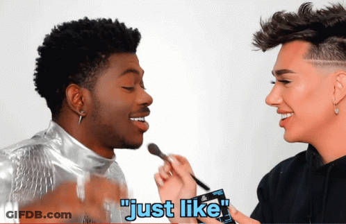 A Man Is Applying Makeup To Another Man 'S Face And The Caption Says " Just Like " GIF