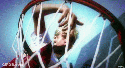 A Man Is Behind A Basketball Hoop That Says Vevo On The Bottom Right GIF