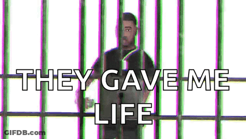 A Man Is Behind Bars With The Words `` They Gave Me Life '' Written Above Him . GIF