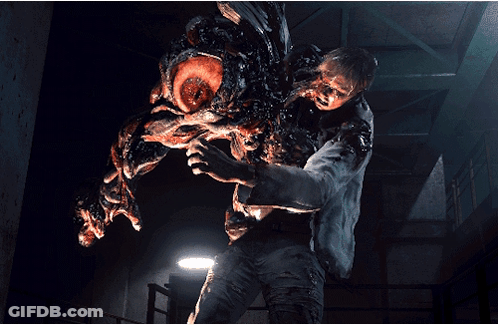 A Man Is Being Attacked By A Monster With A Large Mouth GIF