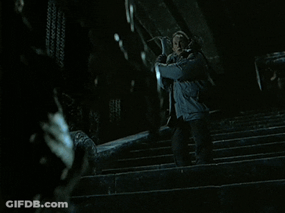 A Man Is Being Attacked By A Predator In A Movie Scene GIF