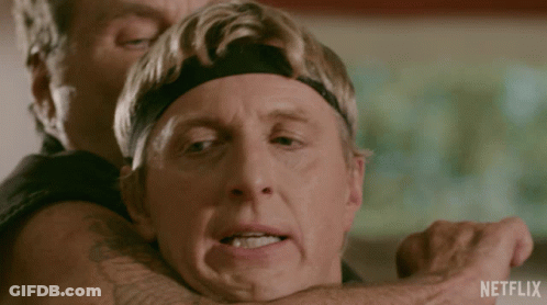 A Man Is Being Held By Another Man With A Netflix Logo In The Corner GIF