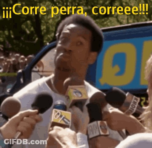 A Man Is Being Interviewed By A Bunch Of Reporters With The Words Corre Perra Correee Written On The Bottom GIF