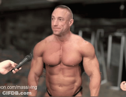 A Man Is Being Interviewed With A Microphone And The Website Www.massiving.com Is Visible GIF