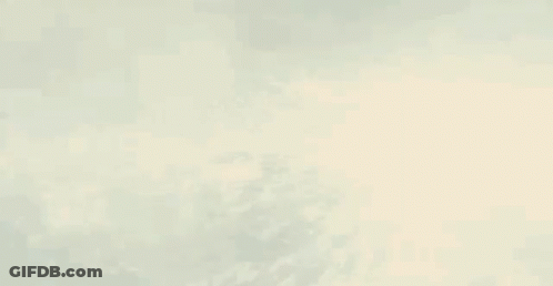 A Man Is Being Struck By A Lightning Bolt In A Dark Room . GIF