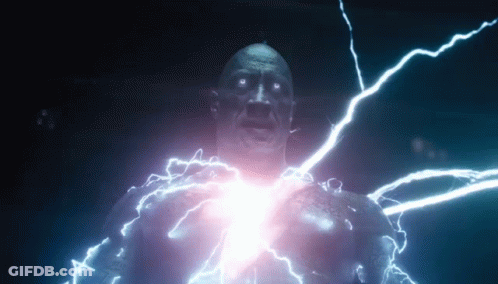A Man Is Being Struck By Lightning While Standing In A Dark Room . GIF