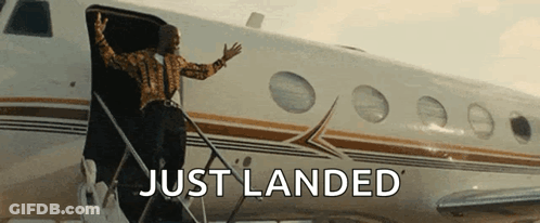 A Man Is Boarding A Plane With The Words Just Landed Written On It GIF