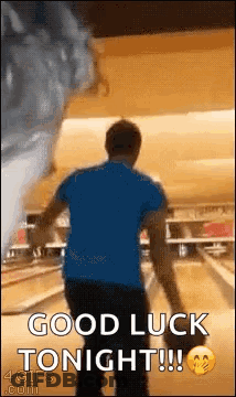 A Man Is Bowling In A Bowling Alley While A Tornado Is Coming In . GIF