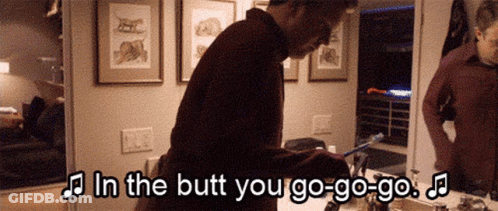 A Man Is Brushing His Teeth In Front Of A Mirror With The Words In The Butt You Go-Go-Go GIF