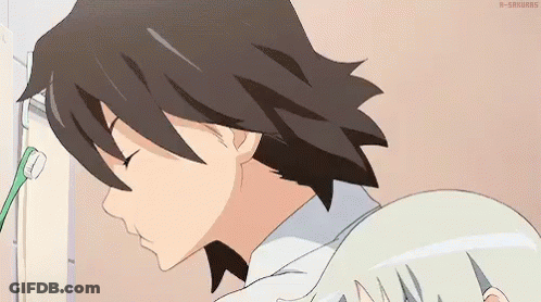 A Man Is Brushing His Teeth With A Toothbrush While A Girl Looks On . GIF