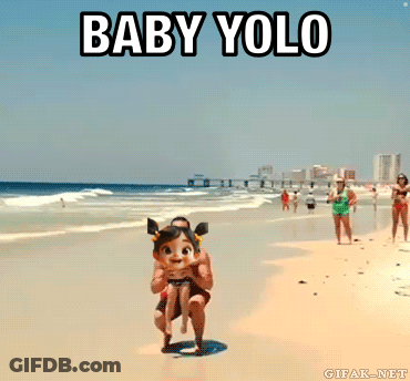 A Man Is Carrying A Little Girl On The Beach With The Words Baby Yolo Below Him GIF
