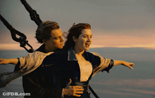A Man Is Carrying A Woman On His Back In The Water GIF