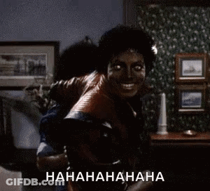 A Man Is Carrying Another Man On His Back In A Living Room And Laughing . GIF