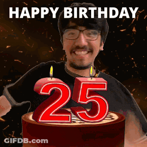 A Man Is Celebrating His 25Th Birthday By Blowing Out Candles On A Cake GIF