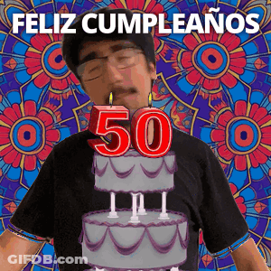 A Man Is Celebrating His 50Th Birthday With A Cake And Candles On It GIF
