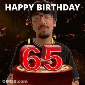A Man Is Celebrating His 65Th Birthday By Blowing Out Candles GIF