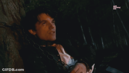 A Man Is Chained To A Tree With The Words Jane Is The Reason Below Him GIF