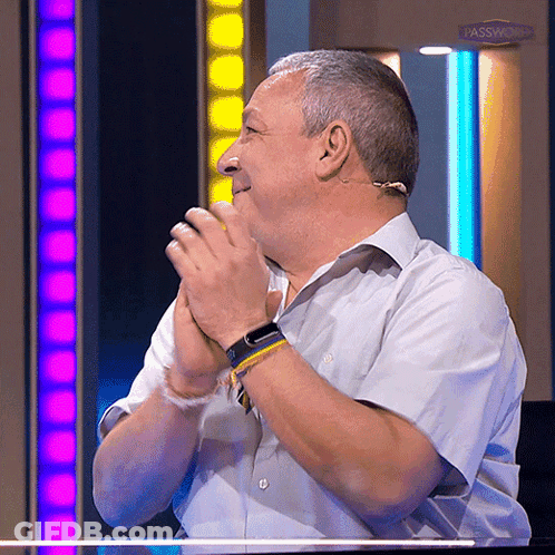 A Man Is Clapping His Hands In Front Of A Sign That Says Passwd GIF