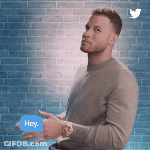 A Man Is Clapping In Front Of A Brick Wall With A Twitter Logo Behind Him GIF