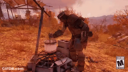 A Man Is Cooking Food On A Stove In The Desert . GIF