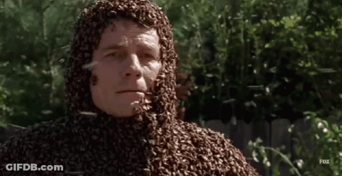 A Man Is Covered In Bees On His Face And Body GIF