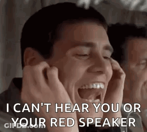 A Man Is Covering His Ears With His Hands While Laughing And Saying I Can 'T Hear You Or Your Red Speaker . GIF