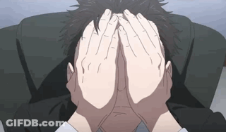A Man Is Covering His Face With His Hands GIF