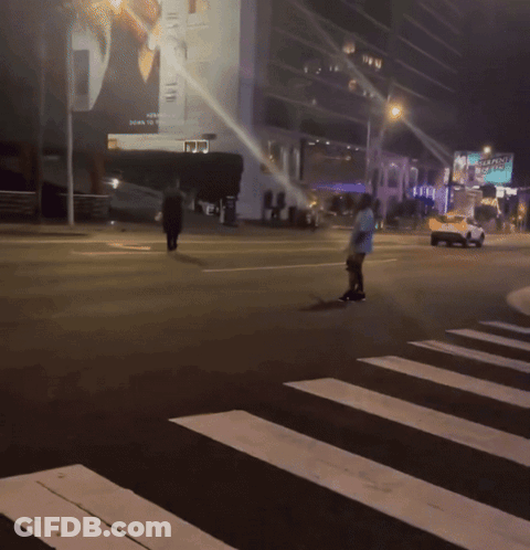 A Man Is Crossing A Street With A Sign That Says Seaplane GIF