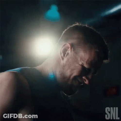 A Man Is Crying In A Dark Room With A Snl Logo In The Corner GIF