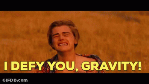 A Man Is Crying In A Field With The Words `` I Defy You , Gravity ! '' Behind Him . GIF