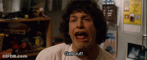 A Man Is Crying In Front Of A Refrigerator And Says `` Get Out '' . GIF