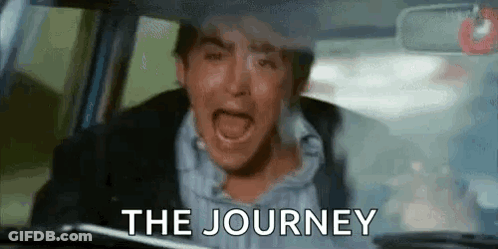 A Man Is Crying While Driving A Car With The Words `` The Journey '' Written On The Windshield . GIF