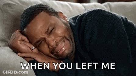 A Man Is Crying While Laying On A Couch And Says `` When You Left Me '' . GIF