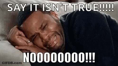 A Man Is Crying While Laying On A Couch With A Caption That Says `` Say It Is N't True ! '' GIF